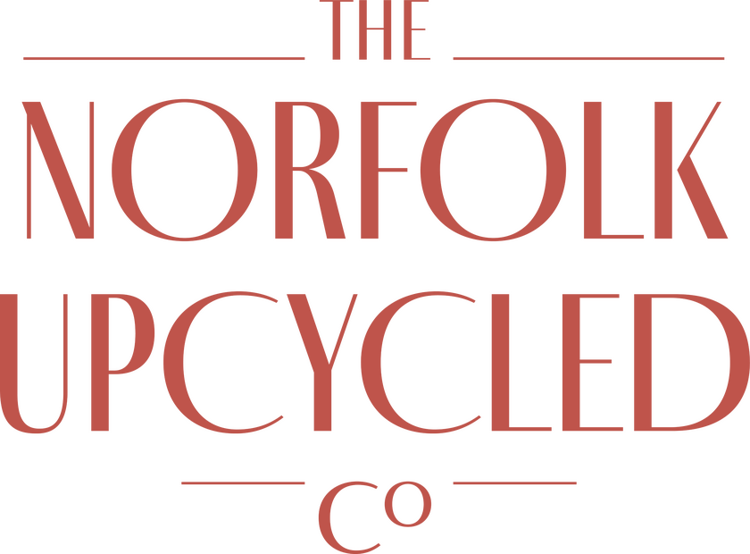 Logo of The Norfolk Upcycled Company in a dark coral colour
